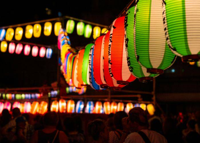 Lanterns lighting up the night of an Obon festival in Japan.